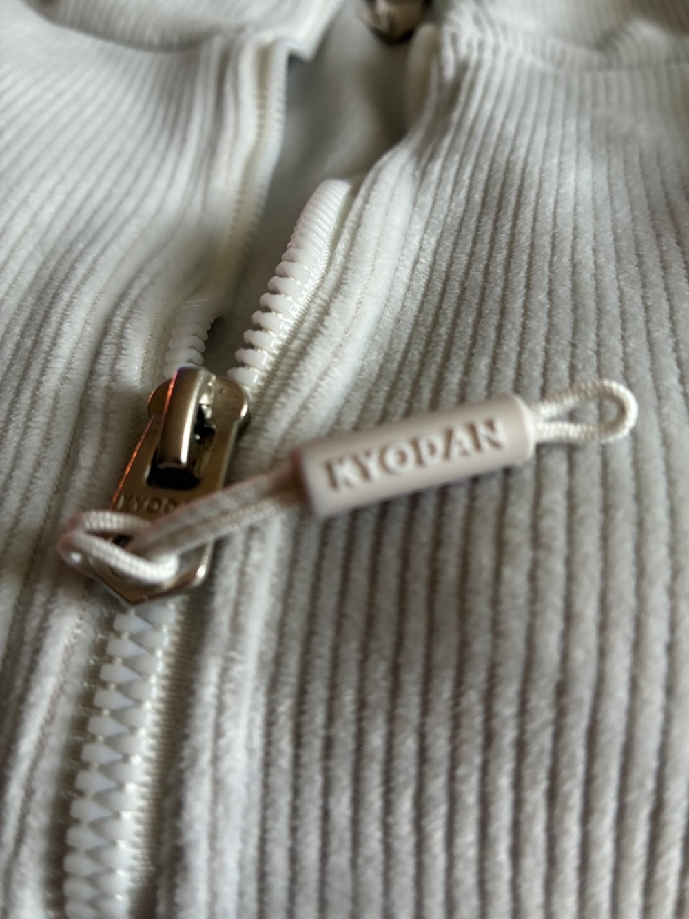 Kyodan Off-White Ribbed Utility Jacket with Branded Zip it’s truly silver color
